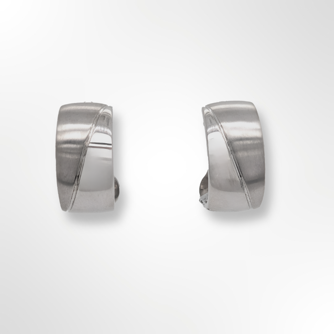 A pair of sterling silver clip-on earrings featuring a stylish curved design.